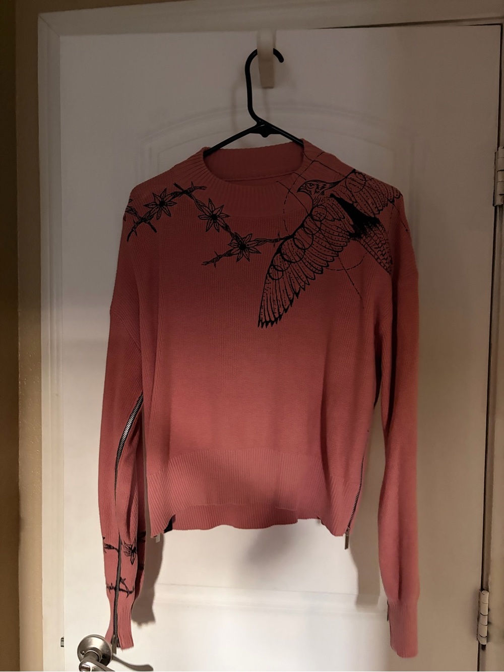 Sacai x Dr. Woo knit sweater featuring a black bird and branch